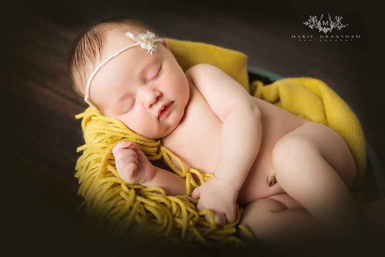 henderson newborn photographer photographing baby on yellow blanket