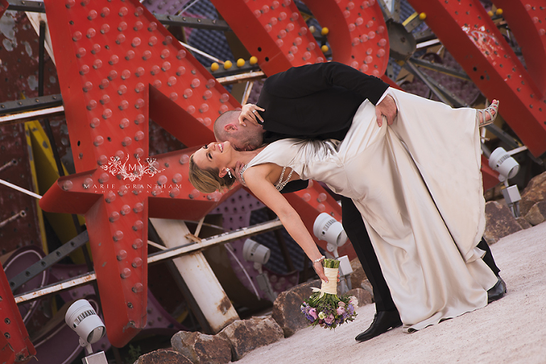 classy bride being dipped down for a kiss during bridal portrait session with marie grantham photography in las vegas